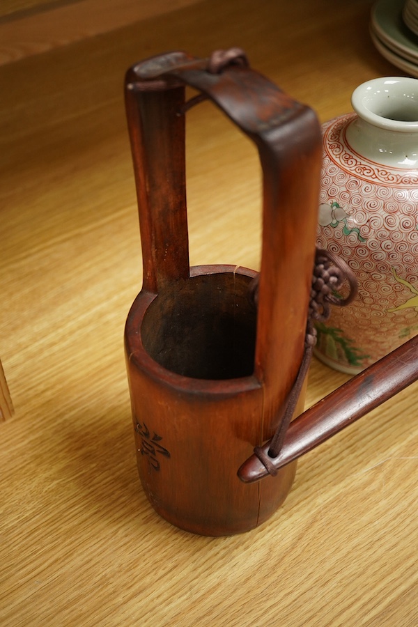 A Chinese famille verte jar, 19cm high together with a miniature bamboo ‘water carrier’, largest 51cm wide. Condition - vase good, carrier, poor